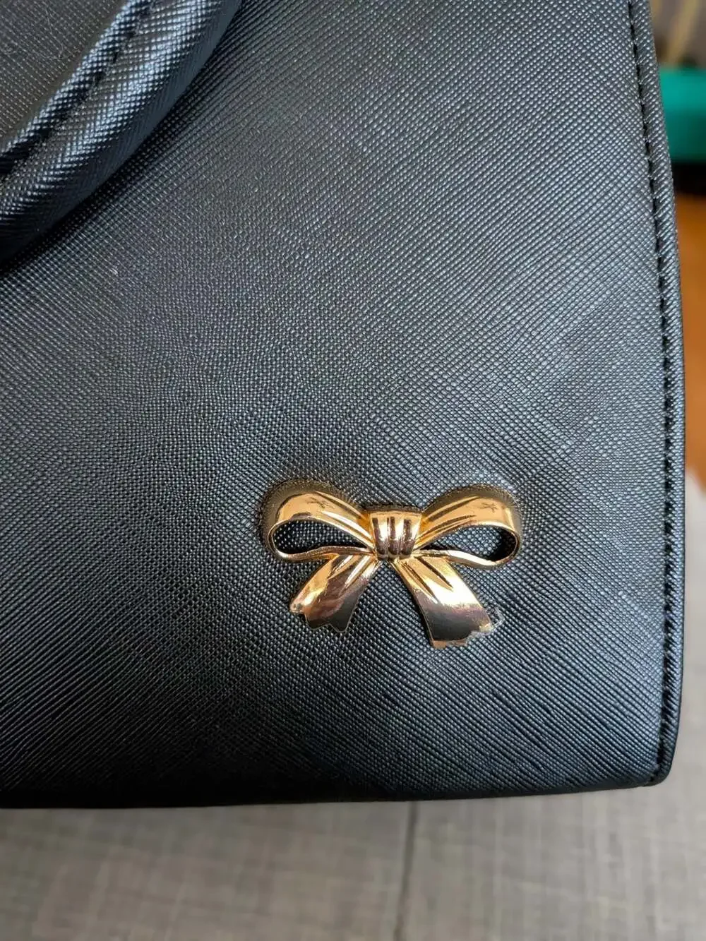 Black Saffiano Leather Handbag Satchel with Gold Bow Accent and Metal Trim